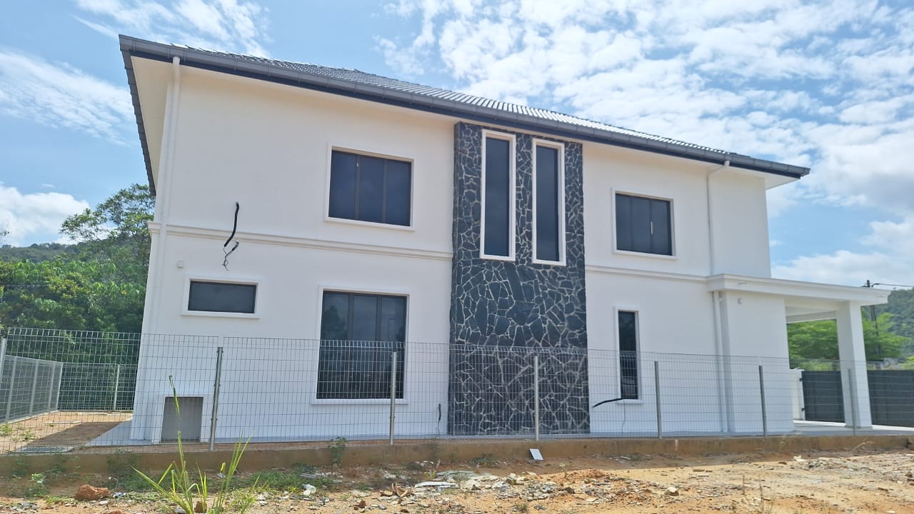 Two-storey house with stone-clad feature wall